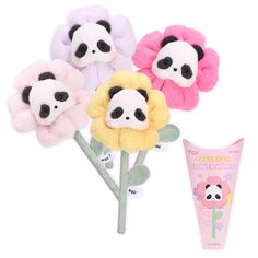 three panda bear hair clips and a tube of toothpaste