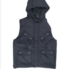 Upper And Lower Pockets Utility Vest With Side Pockets For Winter, Techwear Vest With Pockets For Fall, Black Hooded Outerwear With Side Pockets, Black Cotton Outerwear For Cold Weather, Black Utility Vest For Winter, Techwear Vest For Fall Outdoor Activities, Urban Vest With Pockets For Fall, Fall Outdoor Techwear Vest, Urban Fall Vest With Pockets