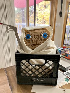 a paper mache in a basket on a table