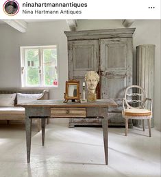 a room with an old table and chair in it