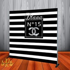 a chanel no 15 sign on a wooden floor