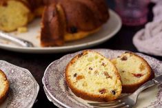 two plates with bundt cakes on them and one has a slice missing from it