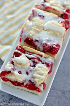 strawberry shortcakes on a plate with white icing