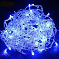 blue led string lights with white wire and plugs on the end are glowing in the dark