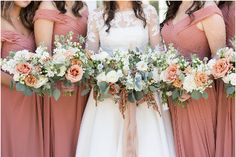 the bride and her bridesmaids are holding their bouquets