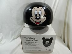 a mickey mouse helmet sitting on top of a box