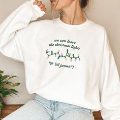 In My Christmas Era Embroidered Crewneck Sweatshirt, We Can Leave The Christmas Lights Up til January Sweater, Christmas Era Hoodie Gildan Sweatshirt G18000 (Hoodie G18500) Details: - 8 oz., 50% usa cotton, 50% polyester - Heather sport colors: 60% polyester, 40% cotton - Made with 50% sustainably and fairly grown usa cotton - Pill-resistant air jet yarn - Double-needle stitching throughout - Double-lined hood(Hoodie) - Pouch pocket(Hoodie) - Matching drawcord - 1x1 ribbed cuffs and waistband with spandex Christmas Sleepover, Gildan Sweatshirt, Embroidered Crewneck, Pocket Hoodie, Sweater Christmas, Gildan Sweatshirts, Air Jet, The Christmas, Christmas Lights