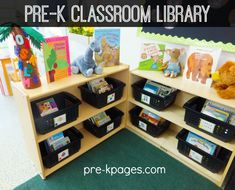 the children's bookshelves are organized with bins for reading and toys