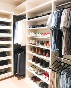 the closet is full of shoes and clothes