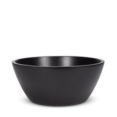 a black bowl sitting on top of a white table