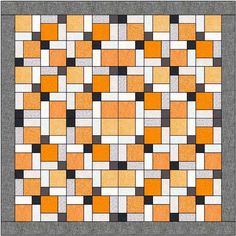 an orange and white quilt with squares on it's sides, all in different colors