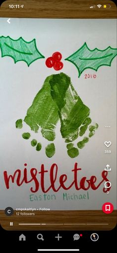 a handprinted christmas card with holly leaves and mistletoes on it