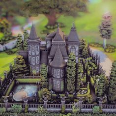 a model of a castle surrounded by trees