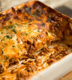 a casserole dish filled with meat and cheese