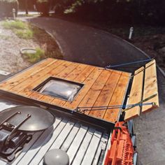 an aerial view of a house made out of wood and metal, with a skylight on the roof