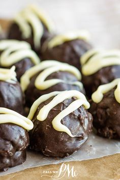 chocolate covered cookies with white icing on top