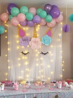 a unicorn themed birthday party with balloons and decorations