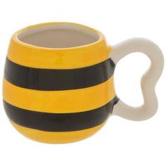 a yellow and black striped coffee mug on a white background with the shape of a heart