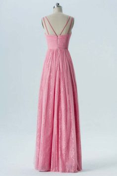 a pink dress on a mannequin dummy with the back cut out and straps down