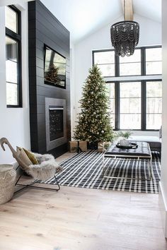 a living room with a christmas tree in the corner