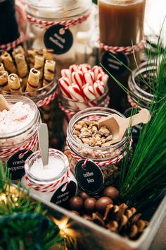 a tray filled with lots of different types of desserts and candies on top of a table