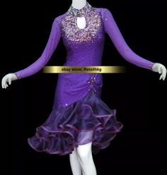 a mannequin wearing a purple dress with sequins