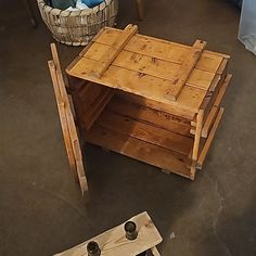 a table made out of wooden pallets and some other woodworking tools sitting on the floor