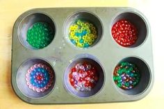 six cupcake tins with beads in them