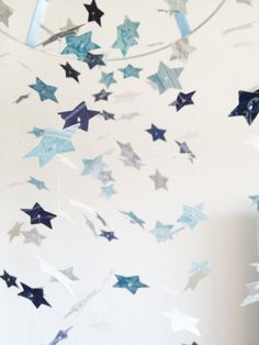 blue and silver stars hanging from the ceiling