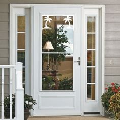 a white front door with a lamp on it