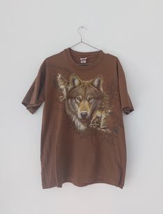 Vintage Woolf Hazelwoods T-Shirt,  Woolf T-Shirt, Size L Brown Tee Man Unisex 100% Cotton Size L but see measurements Measurements laying flat Chest 55cm / 21,65 in x2 Lenght 72cm / 28,35 in Condition used good Brown Short Sleeve Tops With Screen Print, Brown Short Sleeve Top With Screen Print, Brown Crew Neck Graphic Tee, Brown Crew Neck Graphic Tee Shirt, Brown Short Sleeve T-shirt With Graphic Print, Brown Graphic Tee Shirt With Graphic Print, Brown Graphic Print T-shirt With Short Sleeves, Pre-shrunk Brown Crew Neck T-shirt, Brown Crew Neck Top