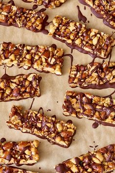 several pieces of chocolate covered granola bars on parchment paper