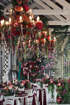 a room filled with lots of tables covered in flowers