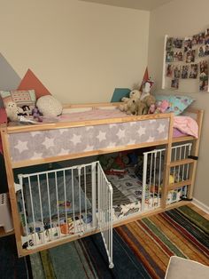 a child's bedroom with a bunk bed and baby crib