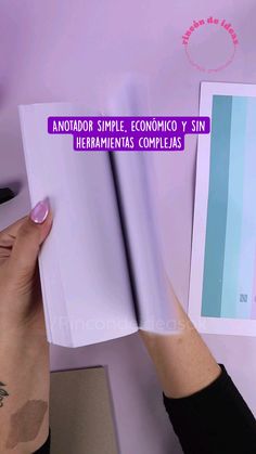 a person is holding an open book in their left hand, with the text anatoador simple, economic y sin hermenias compleas