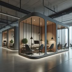 an office cubicle with chairs, desks and plants in the windows at night