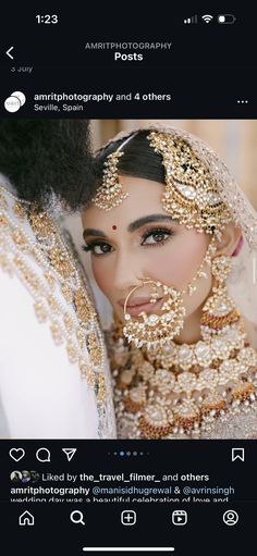 an image of a bride and groom with gold jewelry on their heads, posing for the camera