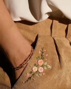 a close up of a person's foot with flowers on it