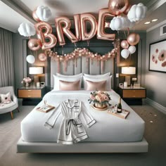 a bed with balloons that say bride and some flowers on the headboard in front of it