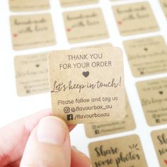 a hand holding a small business card with the words thank you for your order