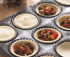 many pies are lined up in the pan and ready to go into the oven