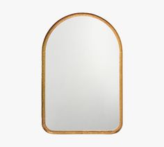 an oval shaped mirror with a gold frame on a white background, it is isolated from the side