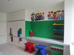 a child's room with legos on the wall