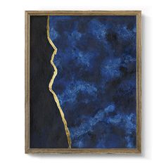 an abstract painting with blue and gold paint on the bottom, in a wooden frame