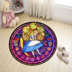 a stained glass door mat with a cartoon character on it and a teddy bear next to it