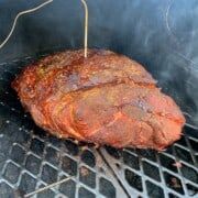 a steak is being cooked on the grill