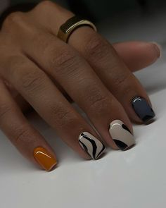 This nail design embraces the beauty of fall with a sophisticated blend of earth tones. The nails feature a matte finish in deep brown and beige shades, with an accent nail showcasing a chic black and white abstract design. The use of color blocking and minimalist art creates a super trendy look that’s perfect for any occasion.   Photo credit by: @dovenailsbysharon Square Nail Designs Baddie, Winter Natural Nails, Short Fall Acrylic Nails, Short Fall Acrylic, Shorties Nails, Fall Acrylic, Sassy Nails, Easy Nails, Work Nails