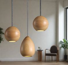 three wooden hanging lights in an empty room