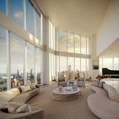 a large living room filled with lots of furniture and tall windows overlooking the cityscape