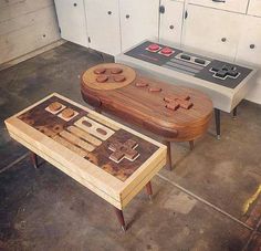 two wooden tables with game controllers on them